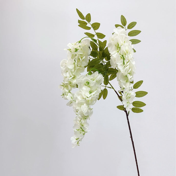 Artificial flower branch with lifelike, hanging flowers