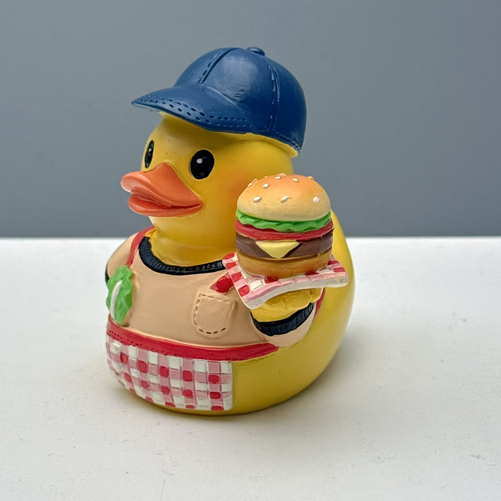 Funny rubber duck as grill master
