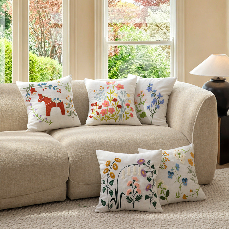 Embroidered linen decorative pillow with botanical flower embroidery