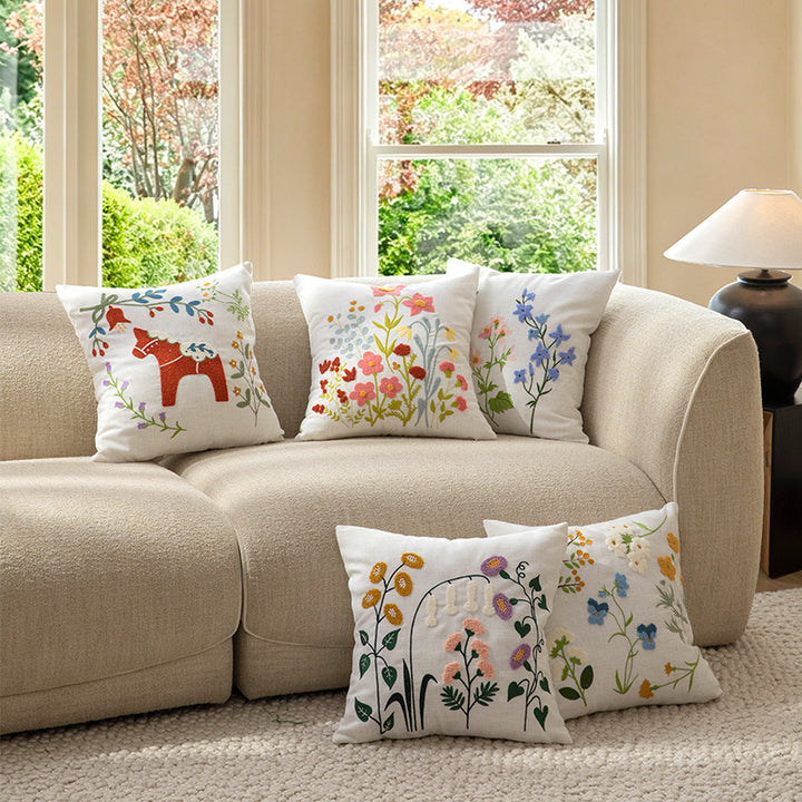 Embroidered linen decorative pillow with botanical flower embroidery