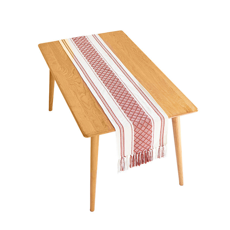 Handwoven cotton table runner with ethnic diamond pattern and fringes