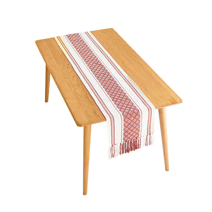 Handwoven cotton table runner with ethnic diamond pattern and fringes