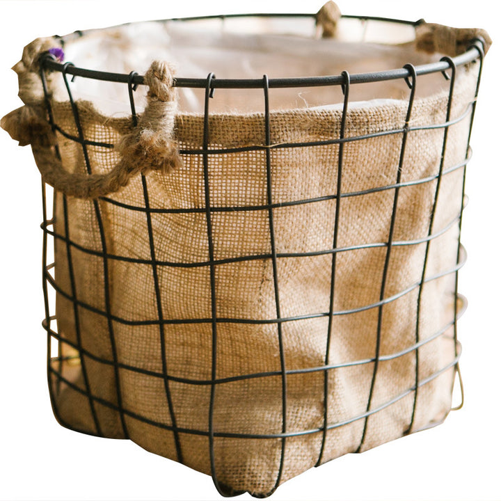 Decorative storage basket made of wire and linen