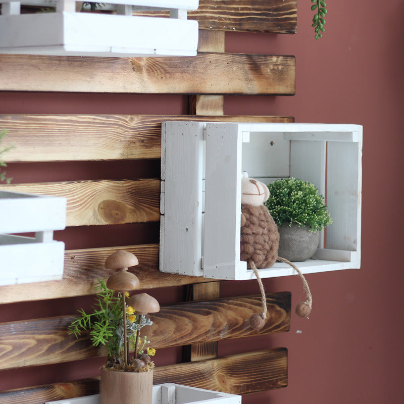 Wall shelf system with integrated storage boxes