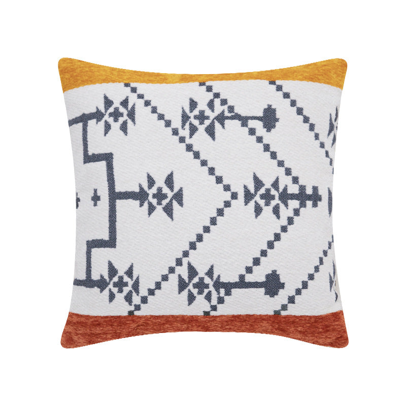 Woven cushion cover with graphic ethnic pattern and contrasting borders