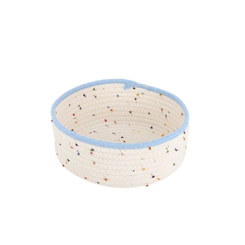 Storage basket made of natural cotton fabric with colorful dots