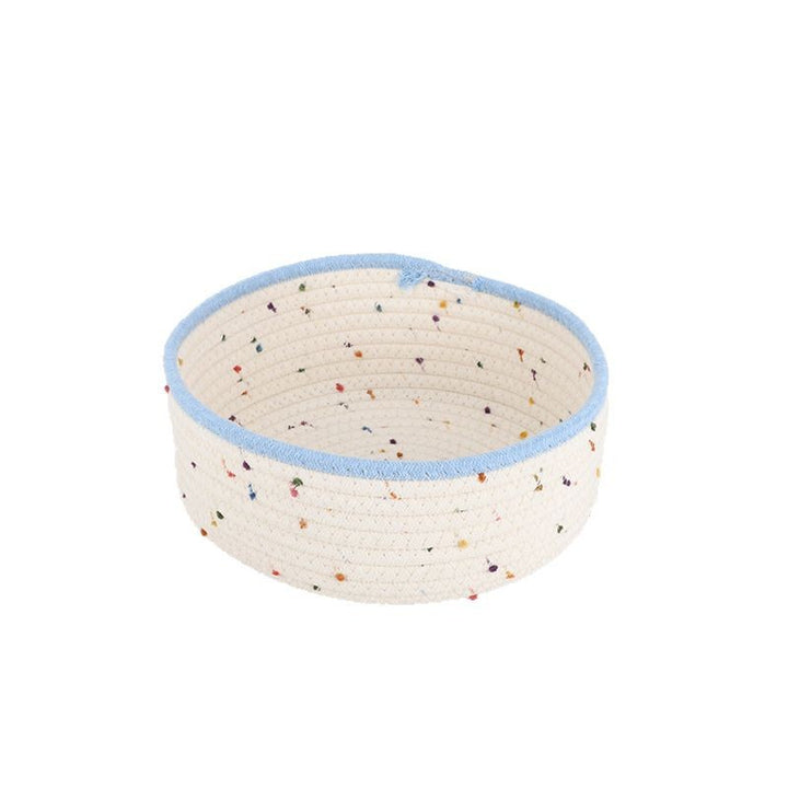 Storage basket made of natural cotton fabric with colorful dots
