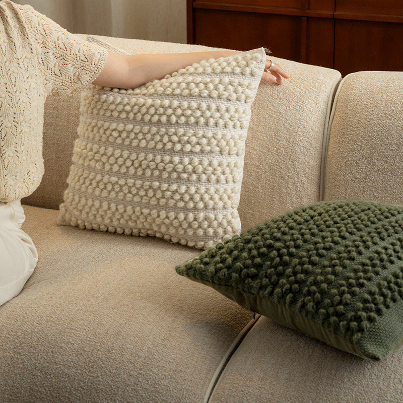 Structured knitted cushion with bobble look