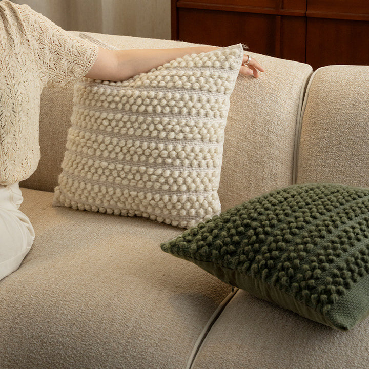 Structured knitted cushion with bobble look