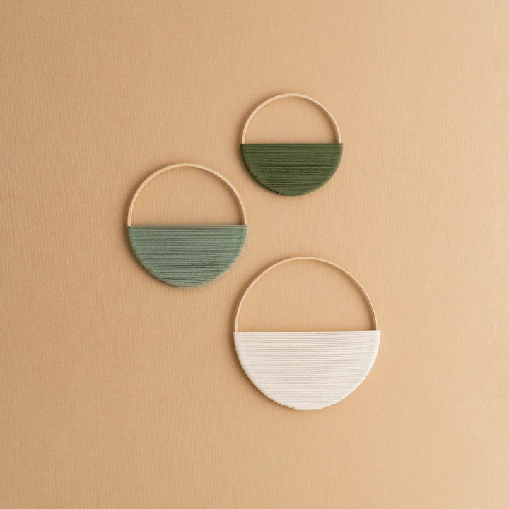 Modern wall art piece made of macrame and wood