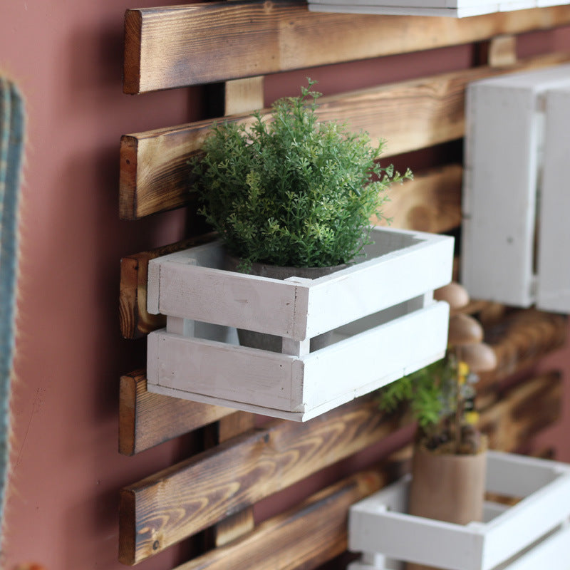 Wall shelf system with integrated storage boxes