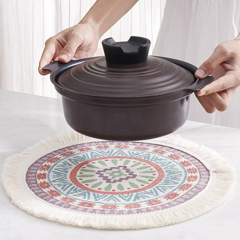 Round flat-woven cotton rug with mandala design and decorative fringes