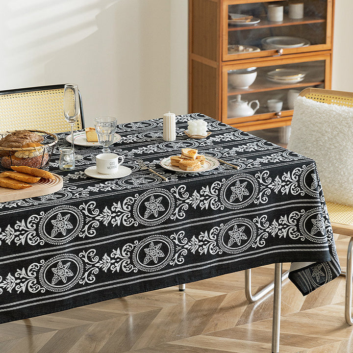 Reversible jacquard tablecloth with floral medallion reliefs