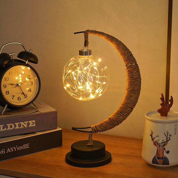 Decorative glass apple LED table lamp with moon-shaped rope-wrapped stand