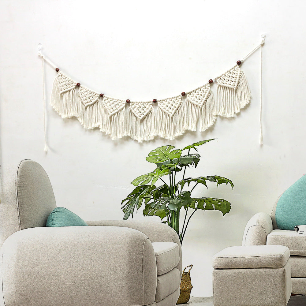Decorative macrame wall hanging with ornate fringes