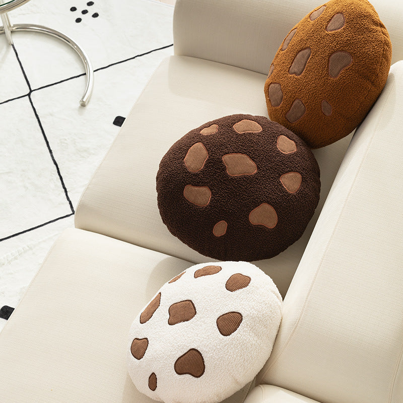 Round cuddle seat cushion with teddy fleece and abstract patch appliqués