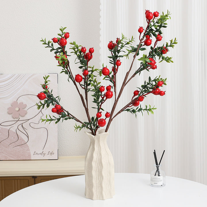 Artificial branch with glowing red berries