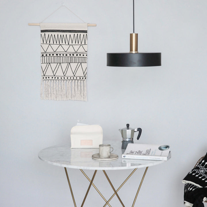 Woven Boho wall hanging with fringes and graphic ethnic pattern