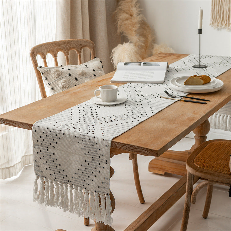 Handwoven table runner made of cotton blend with fringes and geometric dot jacquard