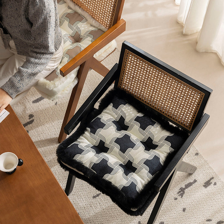 Padded seat cushion with fastening straps, quilted tufting surface and faux fur trim