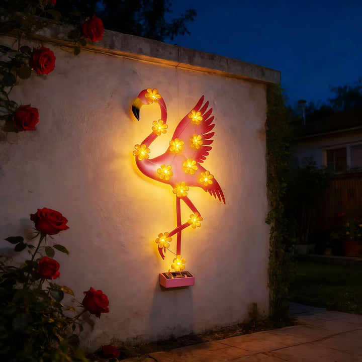 Solar-powered Flamingo LED garden stake light with flower accent lamps