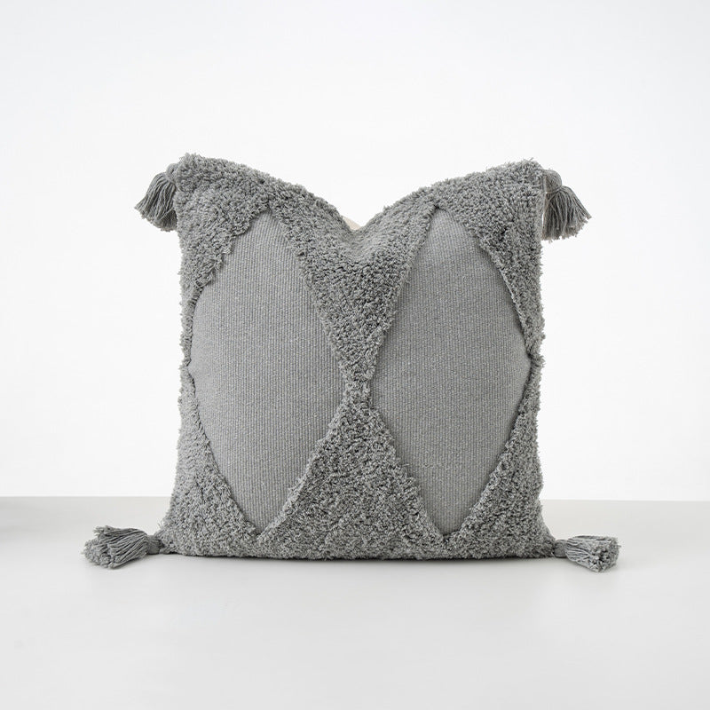 Square cushions with structured boucle look, quilted tufting and decorative tassels