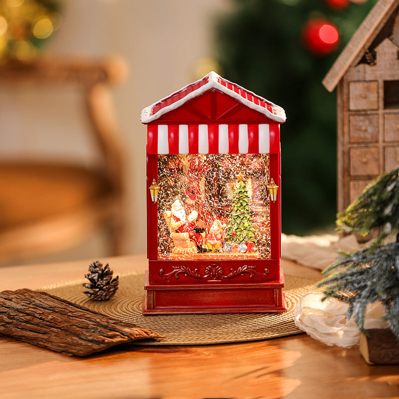 Illuminated Christmas lantern with snow and Christmas motif