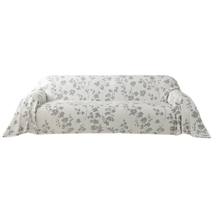 Universal sofa cover with floral relief and elastic hem