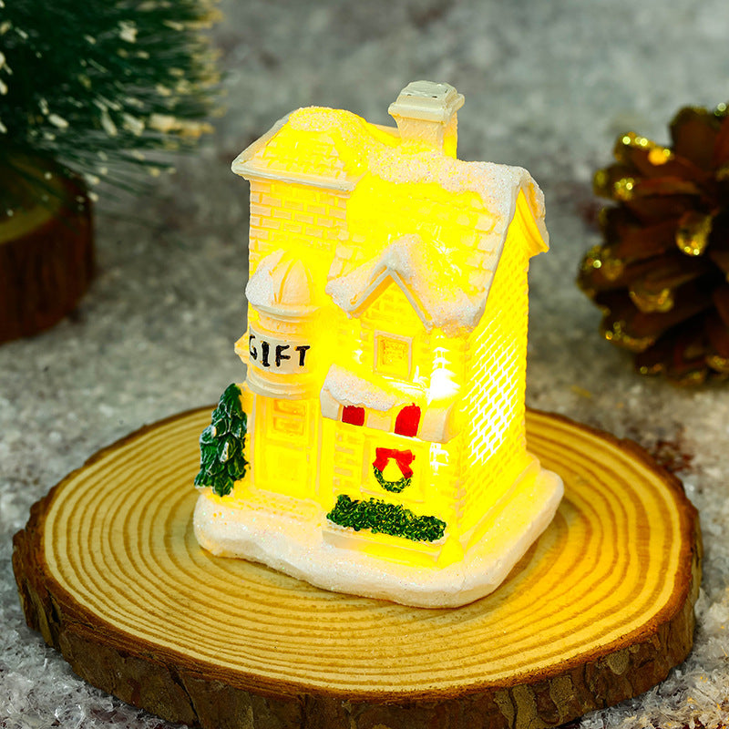 Illuminated Christmas village house with festive decoration