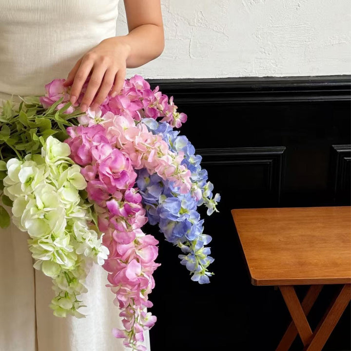 Artificial flower branch with lifelike, hanging flowers