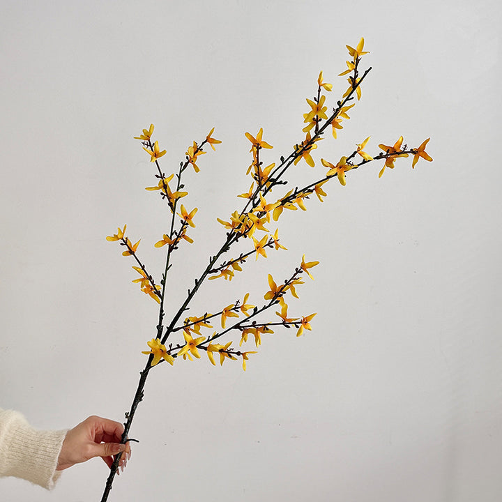 Artificial flower branch with intricately detailed yellow flowers