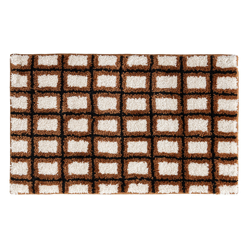 Short pile bath mat with geometric check pattern and non-slip backing