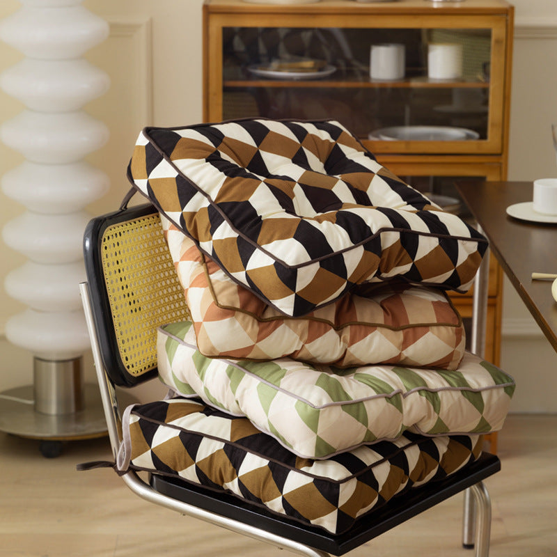 Padded chair cushion with ties and quilted tufted upholstery