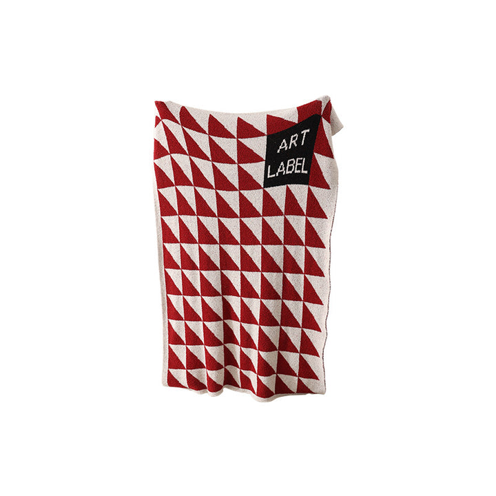 Coarsely woven decorative blanket with geometric jacquard pattern and soft bouclé