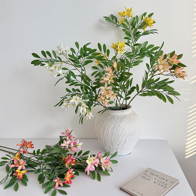 Decorative artificial flower branch with delicate flowers