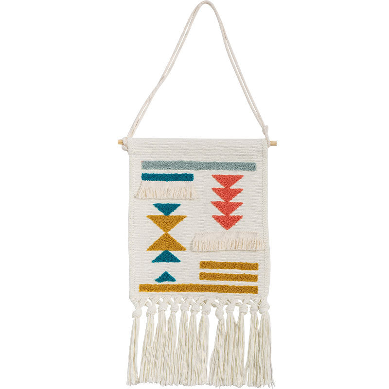 Boho wall hanging made of woven cotton with hand-tufted appliqués and fringes