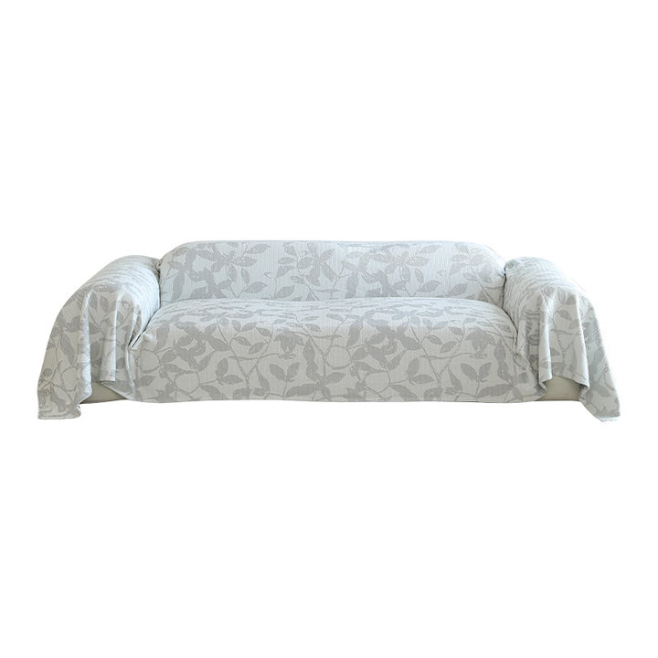 Universal sofa cover with floral relief and elastic hem