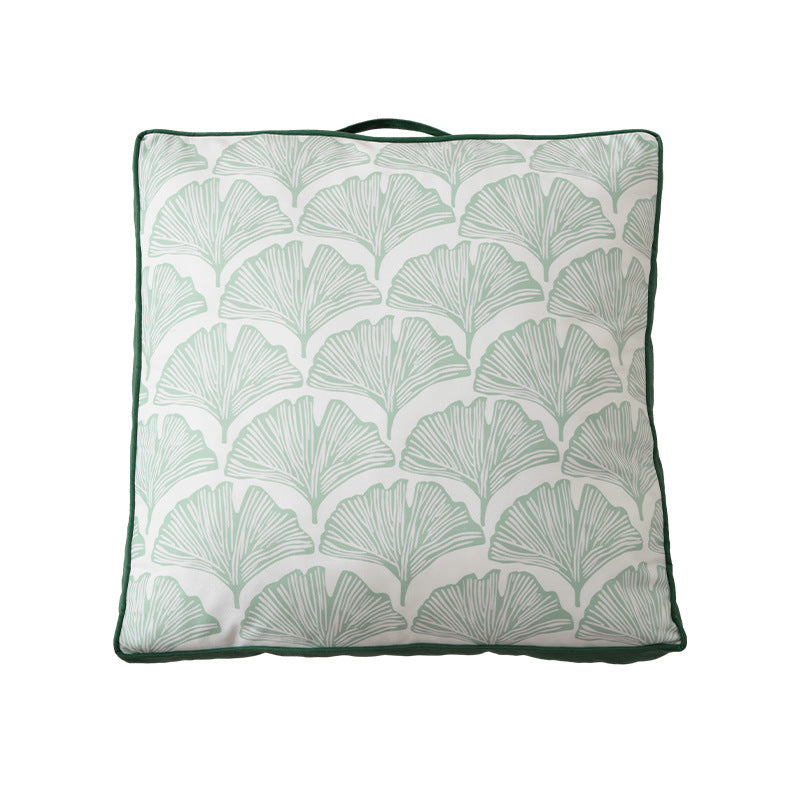 Padded chair cushion with carrying handle and decorative stitching