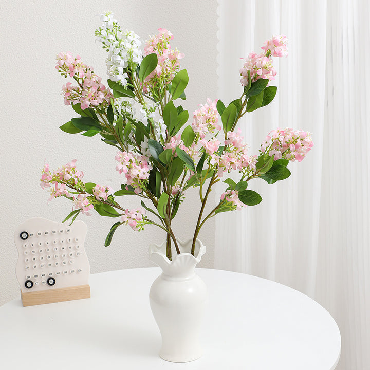 Artificial flower branch with bright flowers