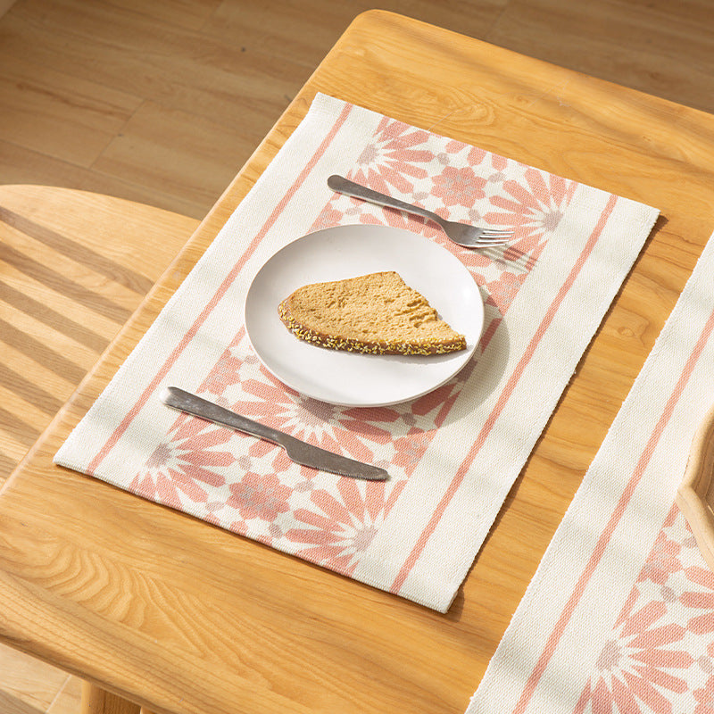 Woven placemat made of cotton blend with geometric diamond trim and fine texture