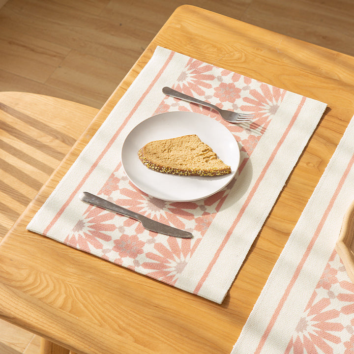Woven placemat made of cotton blend with geometric diamond trim and fine texture