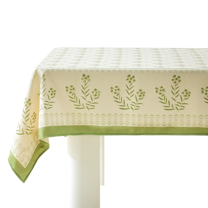 Cotton blend tablecloth with woven floral border decor and green hem