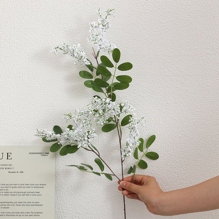 Artificial flower branch with vibrant purple flowers