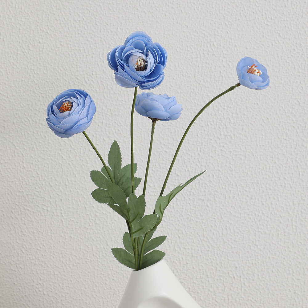 Decorative artificial flower bouquet with intricately detailed ranunculus