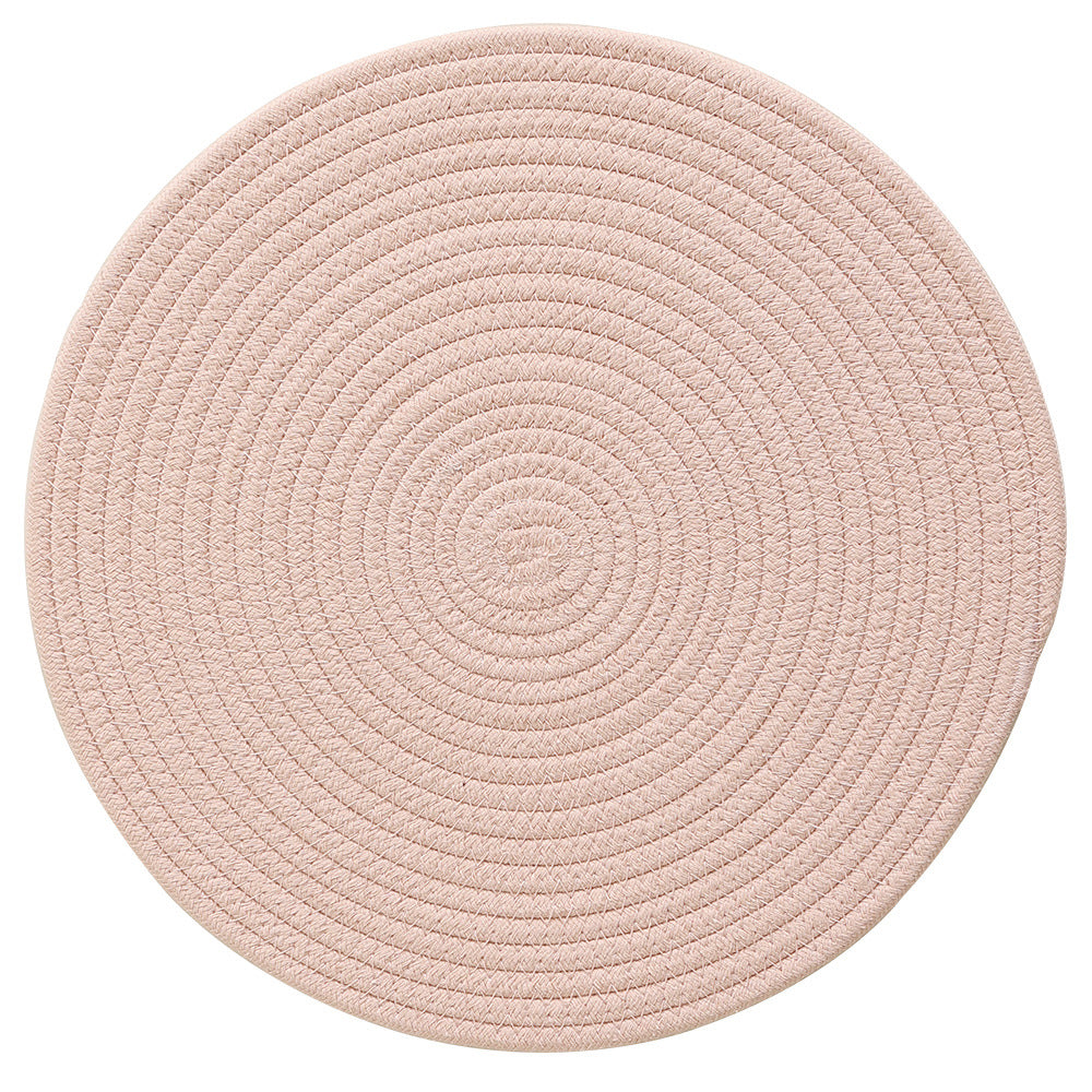 Braided round table mat made of cotton rope and sea grass with spiral structure
