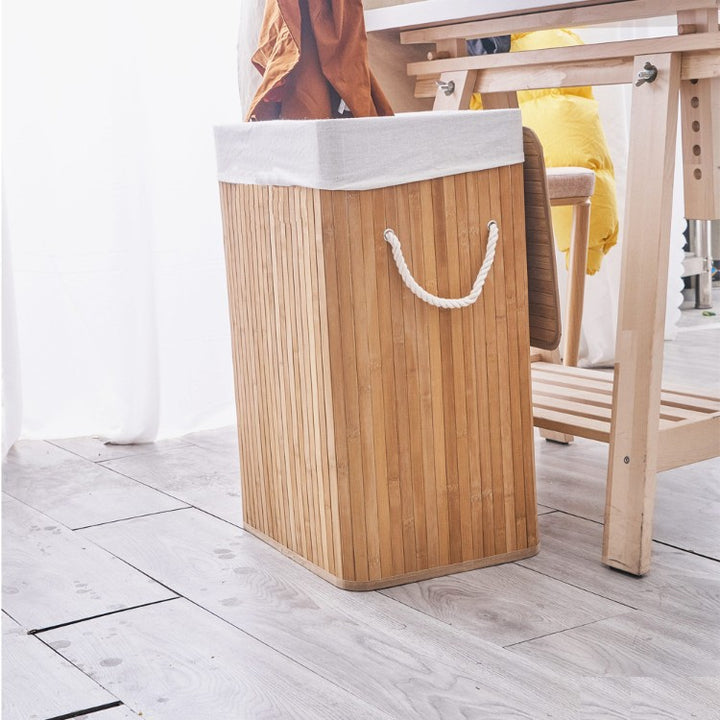 Laundry basket made of natural bamboo with removable cover