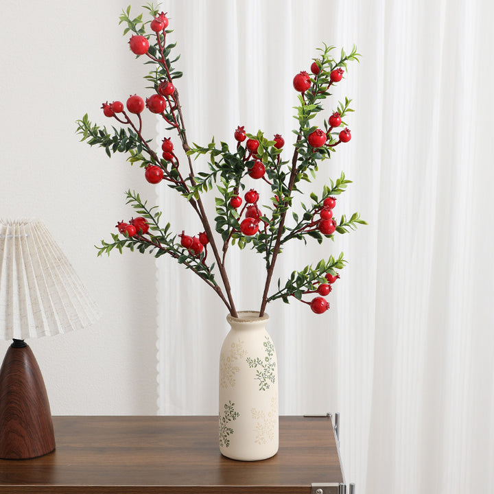 Artificial branch with glowing red berries