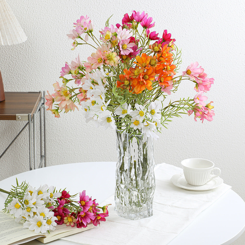 Artificial flower branch with bright pink flowers