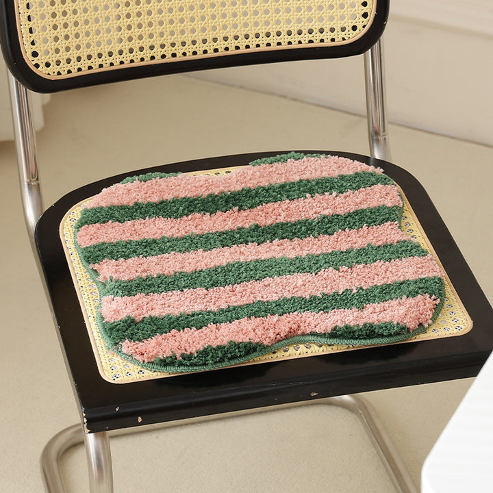 High-pile bath mat rug with diagonal stripe structure and organic shape