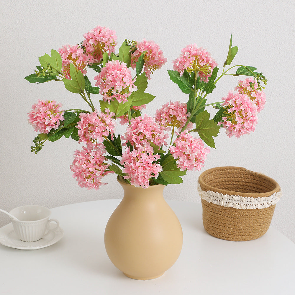 Artificial hydrangea branch with vibrant flowers and detailed leaves